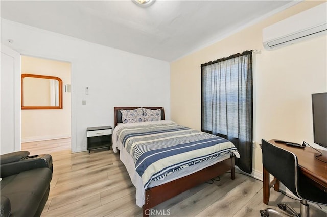 213 S Atlantic Blvd, Alhambra, CA 91801 - bedroom featuring a wall mounted air conditioner and light wood-style flooring