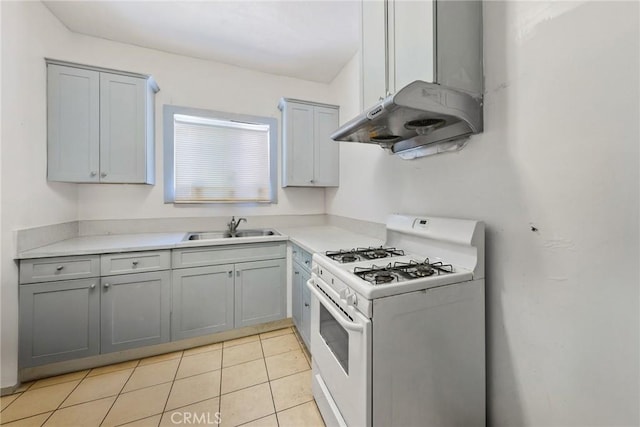 213 S Atlantic Blvd, Alhambra, CA 91801 - kitchen with white gas range oven, gray cabinets, light tile patterned floors, and light countertops