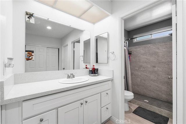 15060 Chatsworth St Unit E, San Fernando, CA 91345 - bathroom with vanity and a tile shower