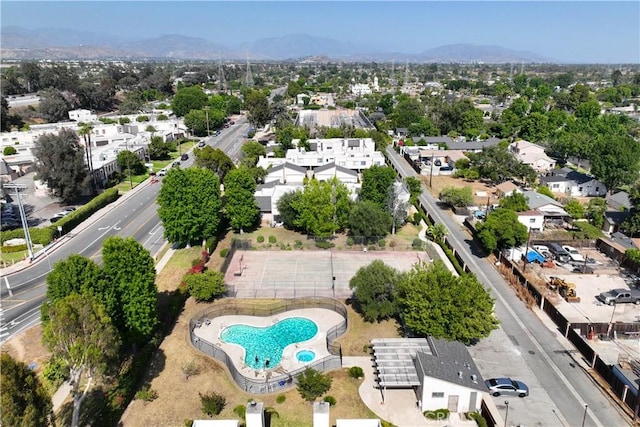 15060 Chatsworth St Unit E, San Fernando, CA 91345 - aerial overview of property's location with a pool area and a mountainous background