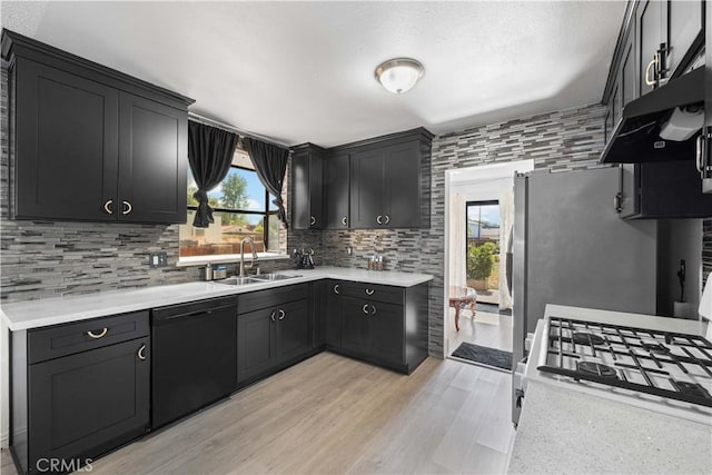 15060 Chatsworth St Unit E, San Fernando, CA 91345 - kitchen featuring dishwasher, plenty of natural light, backsplash, and light countertops