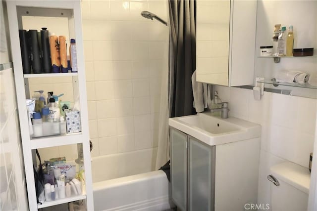 100 Atlantic Ave Unit 906, Long Beach, CA 90802 - bathroom with shower / tub combo, tile walls, and vanity