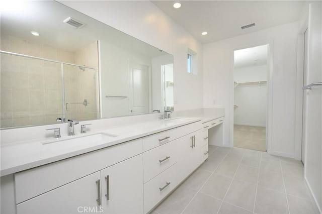 193 Mustang Ln, Palm Springs, CA 92262 - full bath with double vanity, recessed lighting, a shower stall, a spacious closet, and tile patterned flooring
