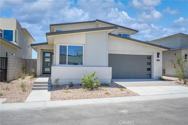 193 Mustang Ln, Palm Springs, CA 92262 - contemporary house featuring an attached garage and driveway