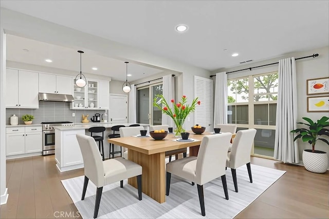 72 Granite, Irvine, CA 92620 - dining room with light wood finished floors and recessed lighting