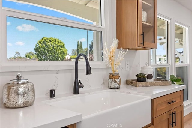 1809 Celeste Ln, Fullerton, CA 92833 - detailed view of brown cabinets, light countertops, and glass insert cabinets