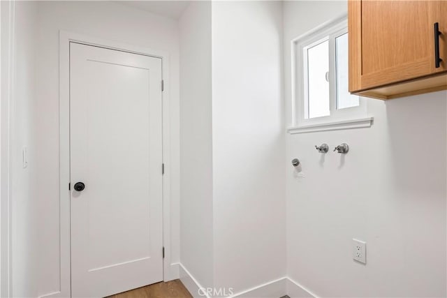 1809 Celeste Ln, Fullerton, CA 92833 - laundry room featuring cabinet space and light wood-style flooring