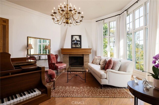 31681 Peppertree, San Juan Capistrano, CA 92675 - living area featuring wood finished floors, a chandelier, crown molding, and a fireplace