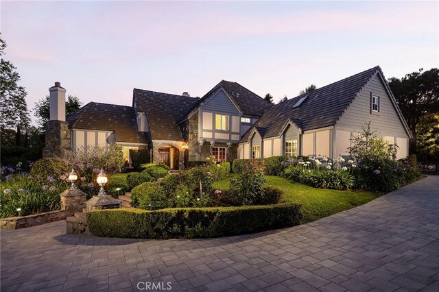 31681 Peppertree, San Juan Capistrano, CA 92675 - tudor home with a chimney and stone siding