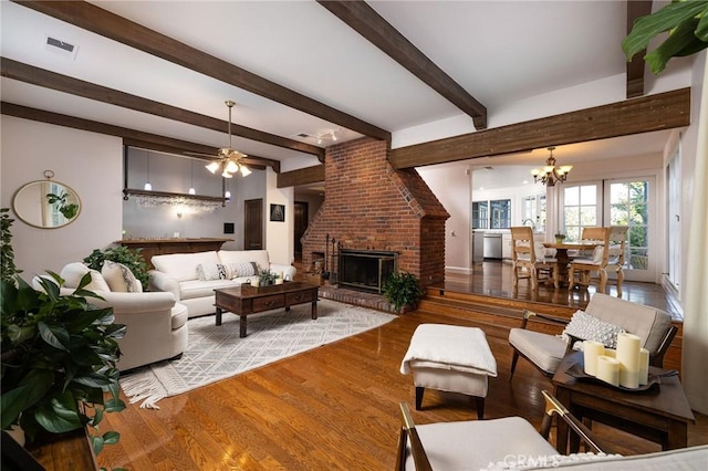 31681 Peppertree, San Juan Capistrano, CA 92675 - living area with wood finished floors, a brick fireplace, a chandelier, beamed ceiling, and ceiling fan