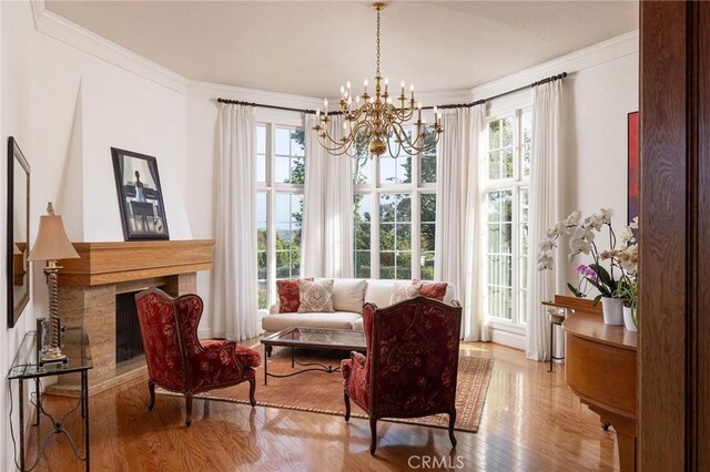 31681 Peppertree, San Juan Capistrano, CA 92675 - sitting room featuring wood finished floors, ornamental molding, plenty of natural light, and a chandelier