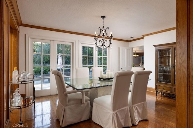 31681 Peppertree, San Juan Capistrano, CA 92675 - dining room featuring a chandelier, crown molding, hardwood / wood-style flooring, french doors, and a textured ceiling