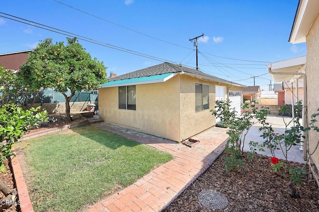 2056 Fulton Ave, Monterey Park, CA 91755 - view of side of property with stucco siding, roof with shingles, and a patio