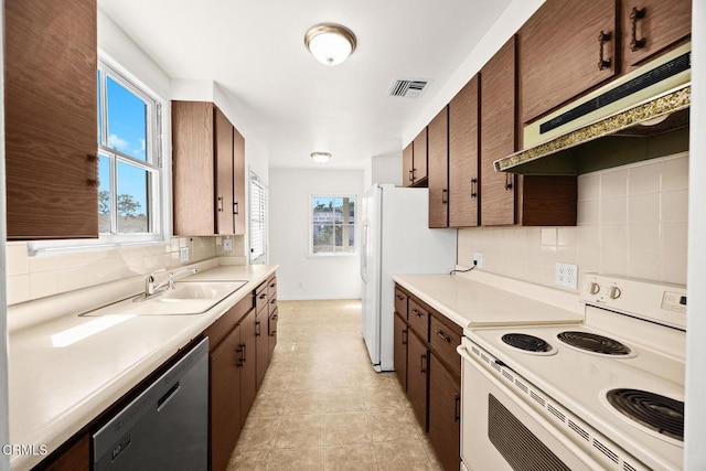 2056 Fulton Ave, Monterey Park, CA 91755 - kitchen featuring white appliances, under cabinet range hood, decorative backsplash, and light countertops