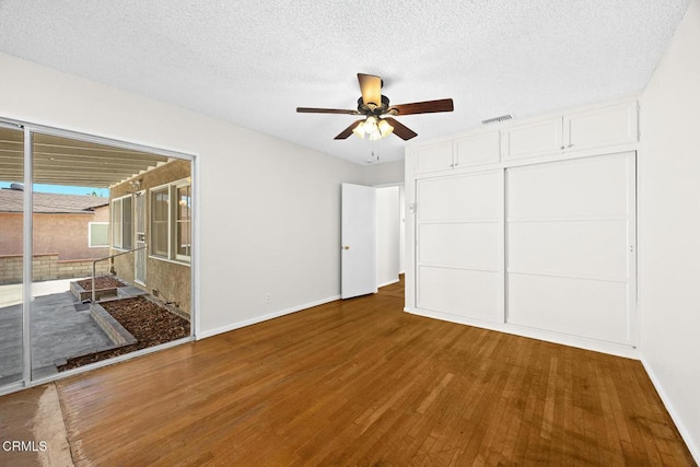 2056 Fulton Ave, Monterey Park, CA 91755 - unfurnished bedroom featuring wood finished floors, a textured ceiling, a ceiling fan, and a closet