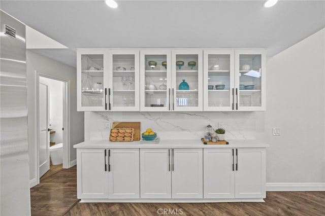 6 Crockett, Irvine, CA 92620 - bar featuring dark wood-style flooring, tasteful backsplash, and recessed lighting