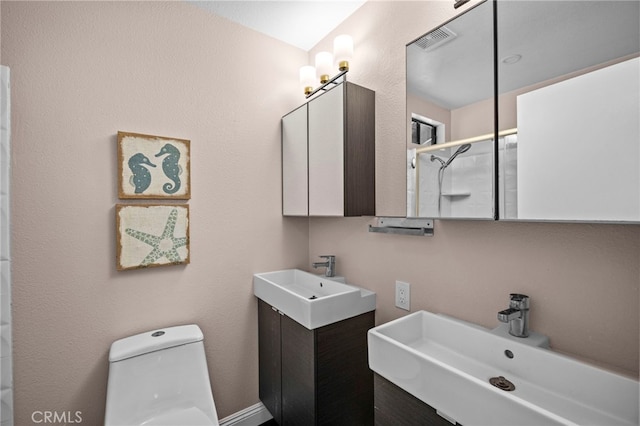 6 Crockett, Irvine, CA 92620 - full bathroom featuring two vanities and toilet