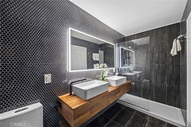 6 Crockett, Irvine, CA 92620 - full bathroom featuring double vanity, walk in shower, and tile walls