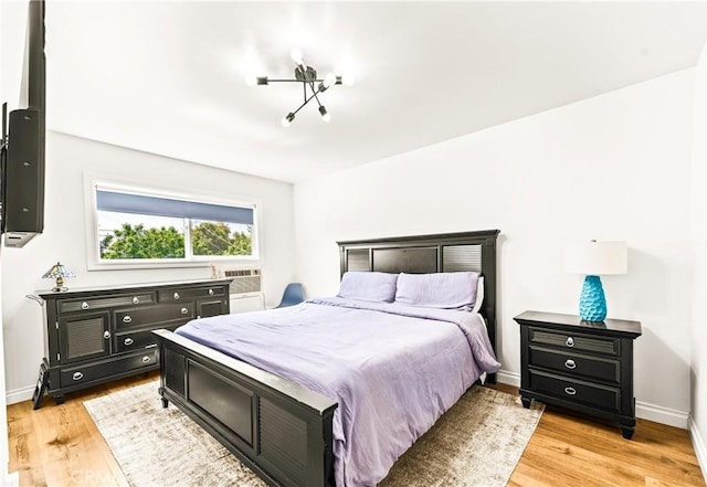 8110 True Ave, Pico Rivera, CA 90660 - bedroom with light wood-style flooring and cooling unit