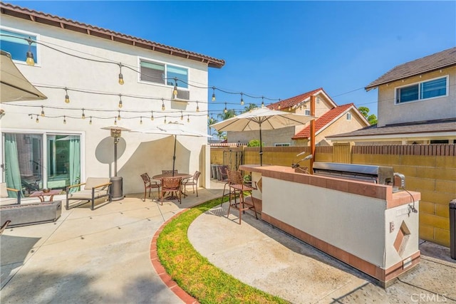 8110 True Ave, Pico Rivera, CA 90660 - fenced backyard with a patio and an outdoor kitchen