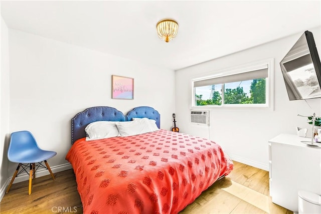 8110 True Ave, Pico Rivera, CA 90660 - bedroom featuring light wood-style flooring and a wall mounted air conditioner