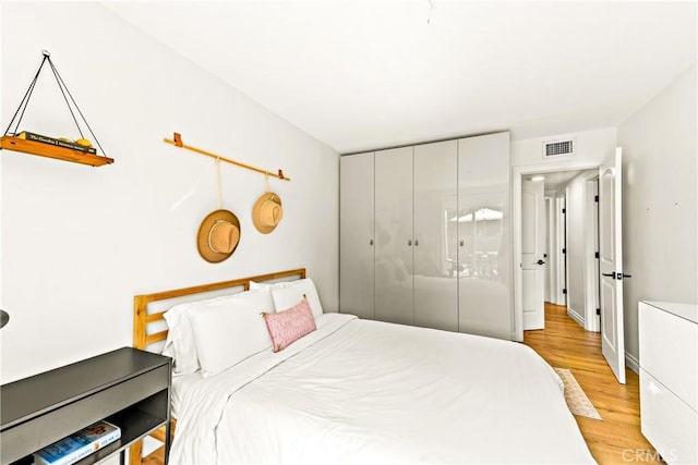 8110 True Ave, Pico Rivera, CA 90660 - bedroom with light wood-style flooring and a closet