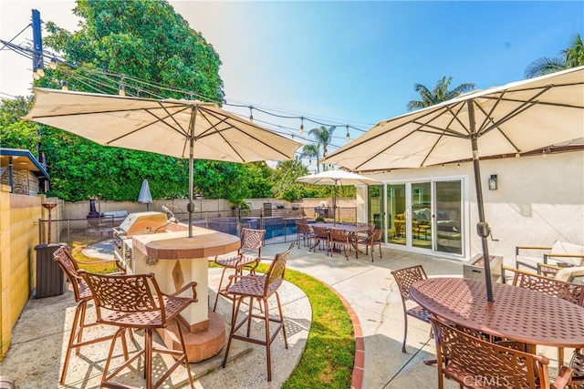 8110 True Ave, Pico Rivera, CA 90660 - fenced backyard featuring outdoor dining area, a patio area, and area for grilling