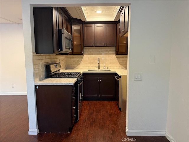 800 Grand Ave Unit A12, Diamond Bar, CA 91765 - kitchen with stainless steel appliances, light countertops, dark wood finished floors, backsplash, and crown molding