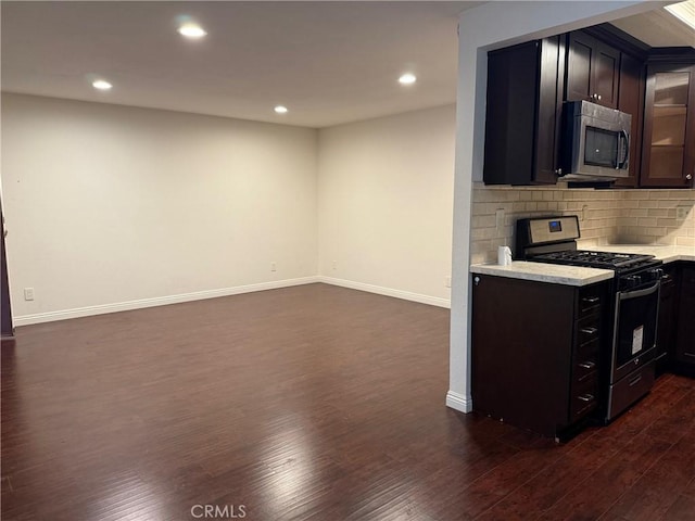 800 Grand Ave Unit A12, Diamond Bar, CA 91765 - kitchen with stainless steel appliances, light countertops, dark wood finished floors, and recessed lighting