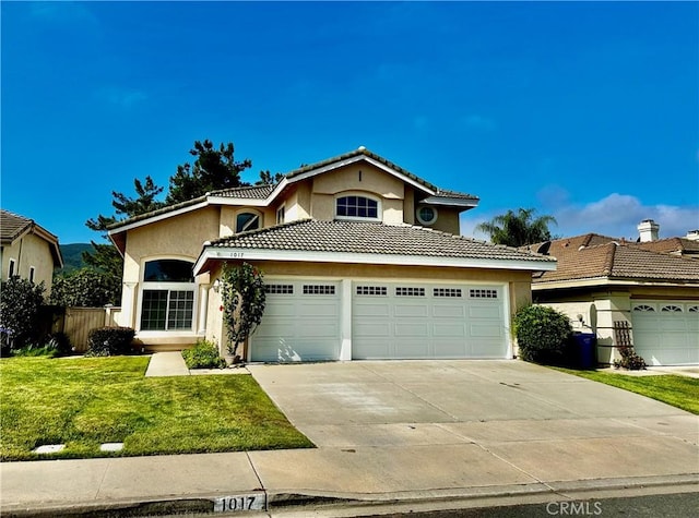 1017 Honeysuckle Dr, San Marcos, CA 92078 - view of front of home featuring stucco siding, driveway, a garage, and a tiled roof