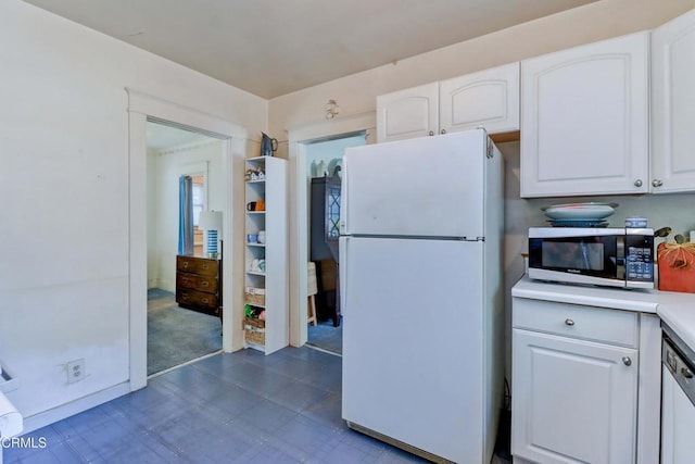 320 W Lemon Ave, Monrovia, CA 91016 - kitchen with white appliances, white cabinetry, dark flooring, and light countertops