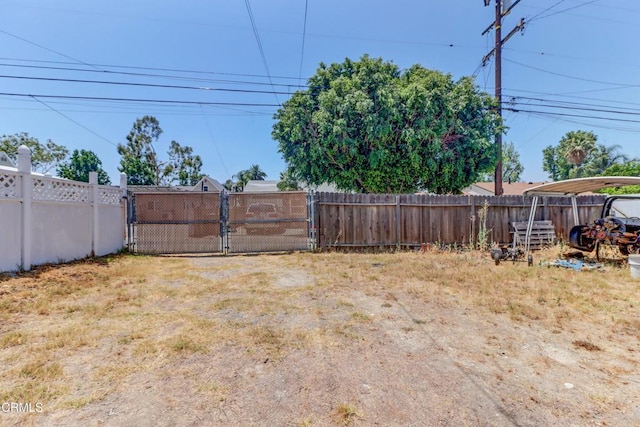 320 W Lemon Ave, Monrovia, CA 91016 - fenced backyard with a gate and a carport