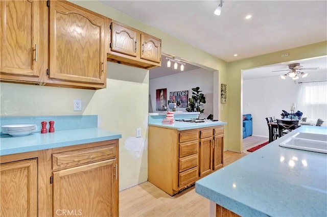 6220 Myrtle Ave, Long Beach, CA 90805 - kitchen featuring light wood-style flooring, light countertops, and ceiling fan
