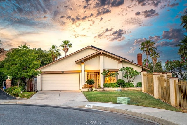 5870 Winncliff Dr, Jurupa Valley, CA 92509 - view of front of house featuring stucco siding, a garage, concrete driveway, and a chimney