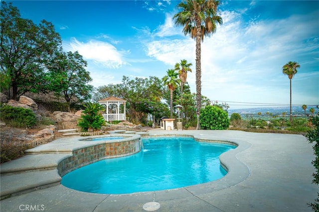5870 Winncliff Dr, Jurupa Valley, CA 92509 - view of swimming pool with a gazebo, a pool with connected hot tub, and a patio area
