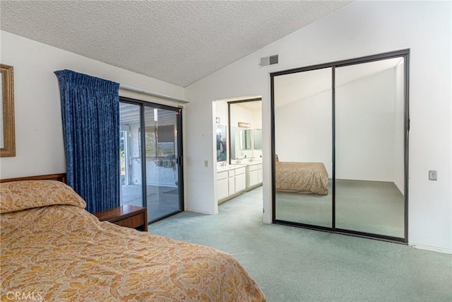 5870 Winncliff Dr, Jurupa Valley, CA 92509 - carpeted bedroom featuring access to outside, vaulted ceiling, a textured ceiling, a closet, and ensuite bathroom