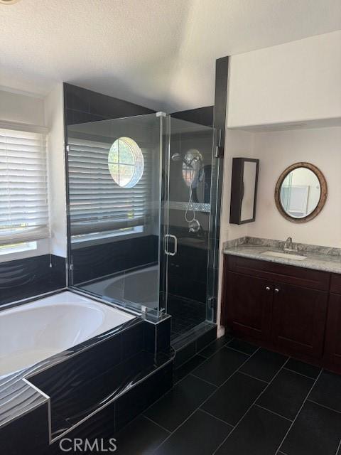 330 E Concord Way, Placentia, CA 92870 - bathroom featuring a shower stall, tile patterned flooring, a garden tub, and vanity