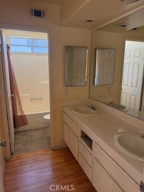 330 E Concord Way, Placentia, CA 92870 - bathroom with double vanity, shower / tub combination, and wood finished floors