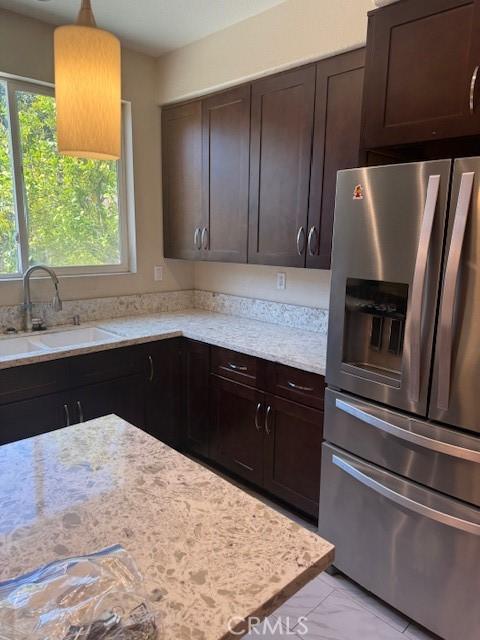 330 E Concord Way, Placentia, CA 92870 - kitchen with stainless steel fridge, dark brown cabinets, and light stone countertops