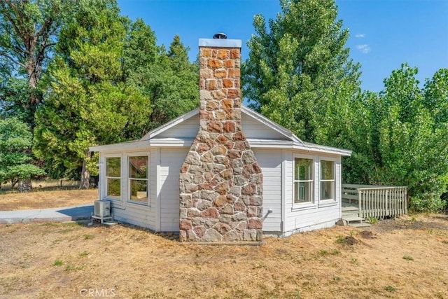 1212 N Old Stage Rd, Mount Shasta, CA 96067 - view of side of property featuring a chimney and a central air condition unit