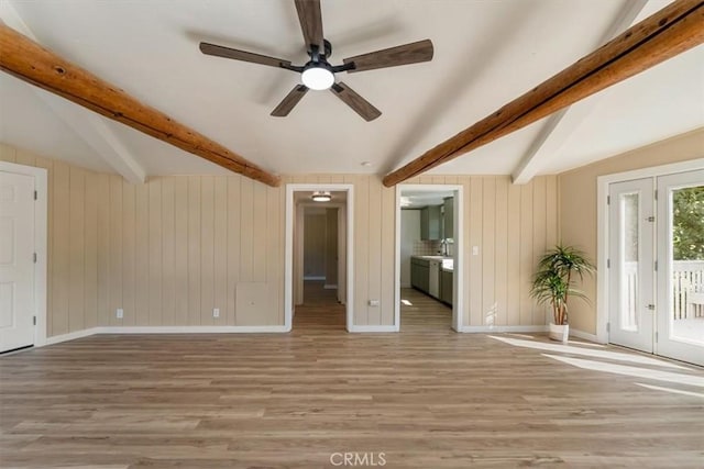 1212 N Old Stage Rd, Mount Shasta, CA 96067 - unfurnished living room featuring light wood-style flooring, ceiling fan, and wood walls