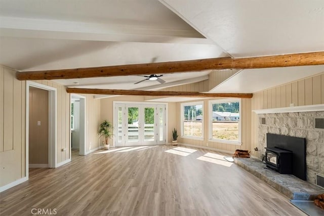 1212 N Old Stage Rd, Mount Shasta, CA 96067 - unfurnished living room with a wood stove, wood finished floors, and a ceiling fan