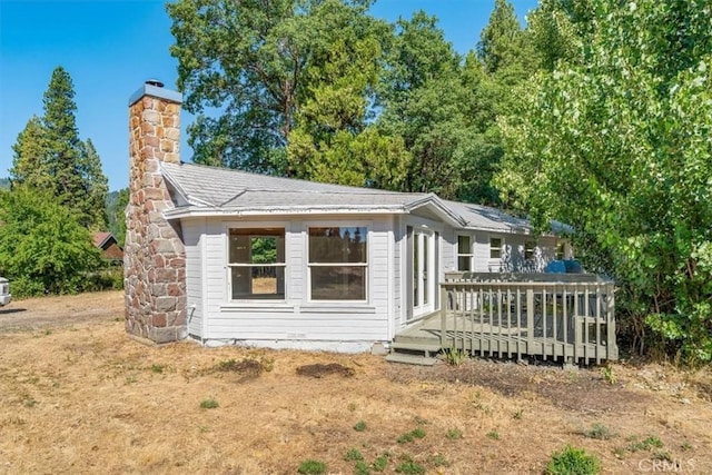 1212 N Old Stage Rd, Mount Shasta, CA 96067 - view of front of house with a deck and a chimney
