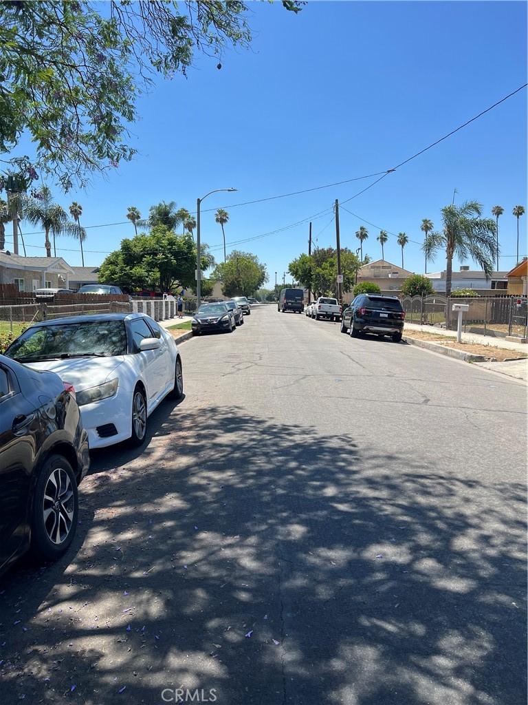 246 E 12th St, Pomona, CA 91766 - view of asphalt road featuring sidewalks, curbs, and street lights