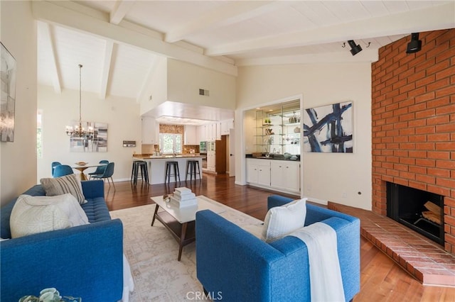 30243 Avenida Selecta, Rancho Palos Verdes, CA 90275 - living room with a chandelier, wood finished floors, and a fireplace