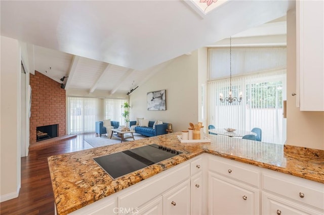 30243 Avenida Selecta, Rancho Palos Verdes, CA 90275 - kitchen featuring open floor plan, black electric cooktop, dark wood-style floors, and light stone counters
