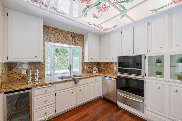 30243 Avenida Selecta, Rancho Palos Verdes, CA 90275 - kitchen with wine cooler, stainless steel appliances, a warming drawer, dark wood-type flooring, and white cabinetry