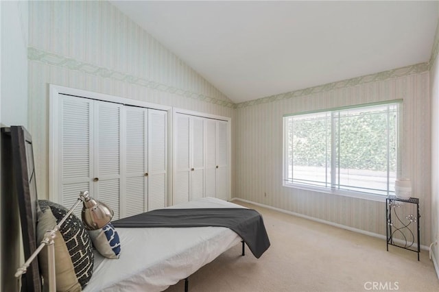 30243 Avenida Selecta, Rancho Palos Verdes, CA 90275 - bedroom with wallpapered walls, multiple closets, lofted ceiling, and light colored carpet