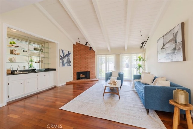 30243 Avenida Selecta, Rancho Palos Verdes, CA 90275 - living room featuring dark wood finished floors, bar with sink, and a brick fireplace
