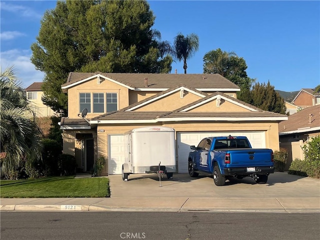 9121 Gold Fields Cir, Corona, CA 92883 - view of front of home featuring driveway, stucco siding, a garage, and a front yard